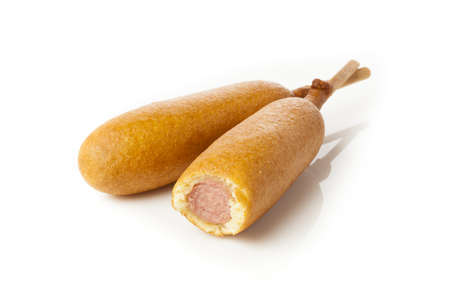 Organic CornDog on a stick with ketchup and mustardの写真素材