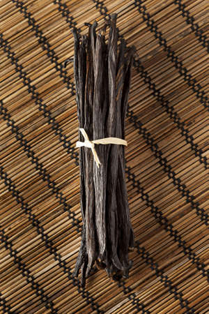 Fresh Brown Organic Vanilla Bean against a background
