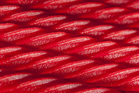 Bright Red Licorice Candy shaped like a twisted ropeの写真素材