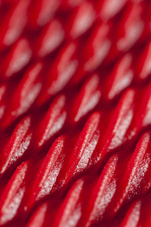 Bright Red Licorice Candy shaped like a twisted ropeの写真素材