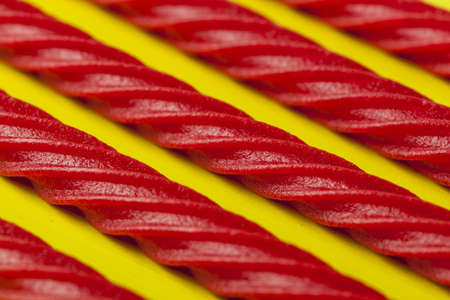 Bright Red Licorice Candy shaped like a twisted ropeの写真素材