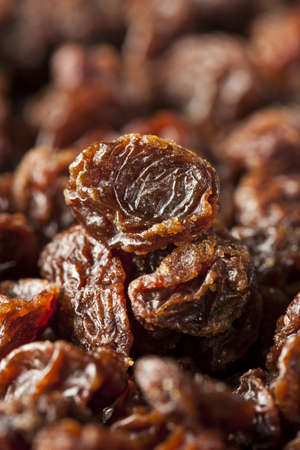 Organic Dried Raw Raisins against a background