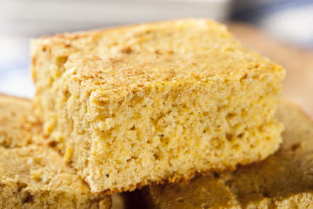 Golden Organic Homemade Cornbread cut into squares