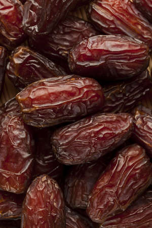 Fresh Organic Raw Brown Date Fruit against a background