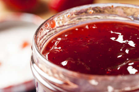 Homemade Organic Red Strawberry Jelly against a background