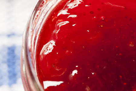 Homemade Organic Red Strawberry Jelly against a background