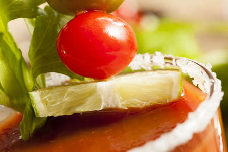 Spicy Bloody Mary Alcoholic Drink with a tomato garnishの写真素材