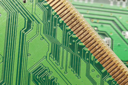 Green Electrical Circuit Board with microchips, conductors, and transistorsの写真素材