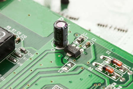 Green Electrical Circuit Board with microchips, conductors, and transistors