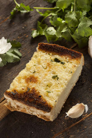 Homemade Crunchy Garlic Bread with butter and parsleyの写真素材