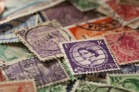 Colorful Vintage Used Postage Stamps in a pile