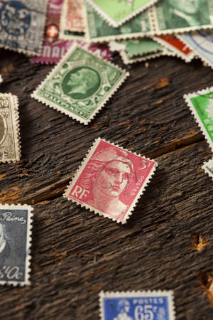 Colorful Vintage Used Postage Stamps in a pile