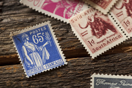 Colorful Vintage Used Postage Stamps in a pileのeditorial素材