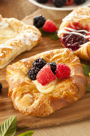 Homemade Gourmet Danish Pastry with berries and icingの写真素材
