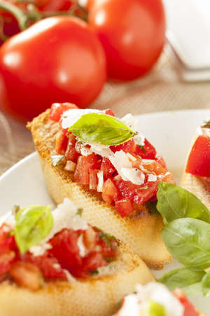 Homemade Tomato and Basil Bruschetta with olive oil on toastの写真素材