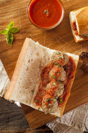 Homemade Spicy Meatball Sub Sandwich with Marinara Sauce and Cheeseの写真素材