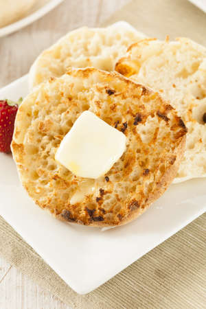 Organic Whole Wheat English Muffins with Butterの写真素材