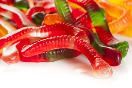Colorful Fruity Gummy Worm Candy on a backgroundの写真素材