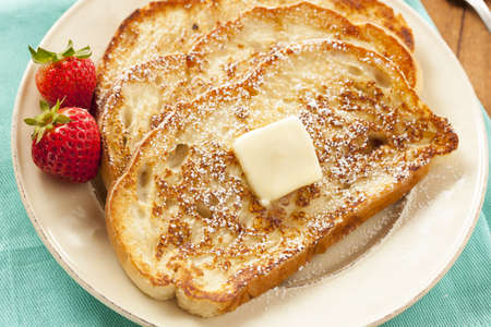 Homemade French Toast with Butter and Powdered Sugar