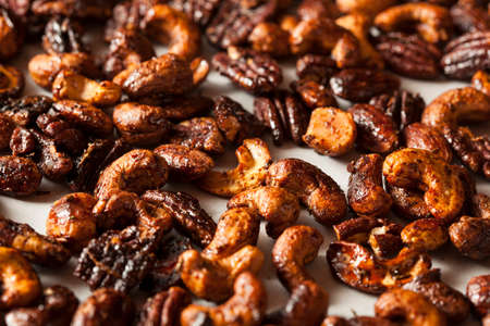 Brown Candied Caramelized Nuts with Cinnamon and Spicesの写真素材