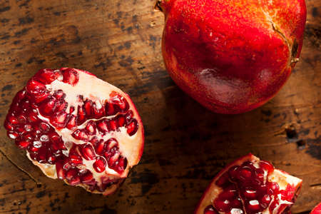 Organic Ripe Red Pomegranates Ready to Eatの写真素材
