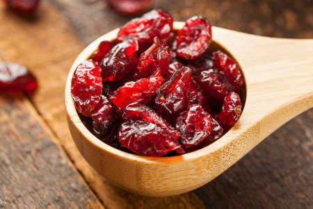 Organic Red Dried Cranberries in a Bowlの写真素材