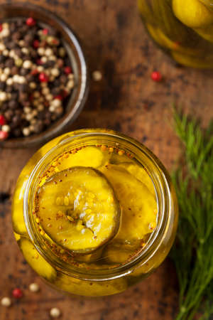 Homemade Organic Crunch Green Pickles in a Jarの写真素材