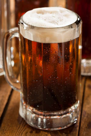Cold Refreshing Root Beer with Foam in a Mug