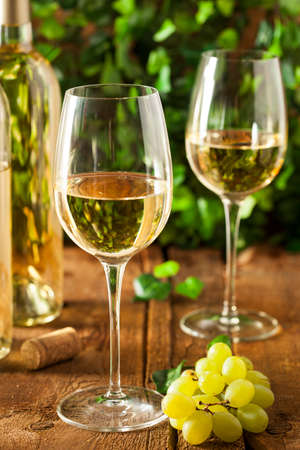 Refreshring White Wine in a Glass on a Backgroundの写真素材