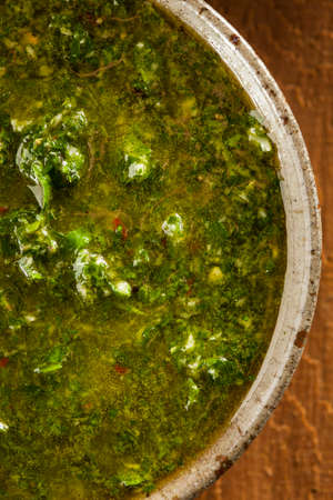 Homemade Green Chimichurri Sauce in a Bowlの写真素材