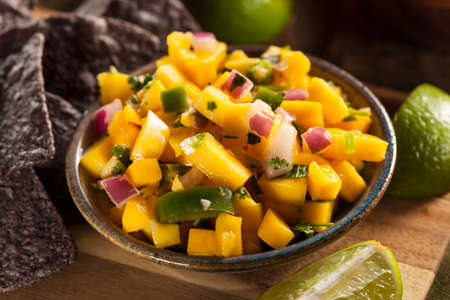 Fresh Homemade Mango Salsa with Corn Chipsの写真素材