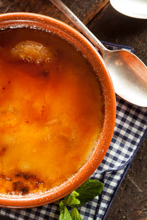 Gourmet Carmelized Creme Brulee with Berries and Mintの写真素材