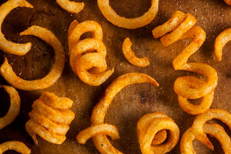 Spicy Seasoned Curly Fries Ready to Eatの写真素材