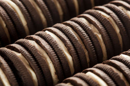 Unhealthy Chocolate Cookies with Vanilla Cream Fillingの写真素材