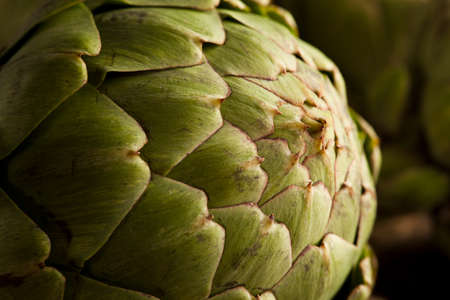 Raw Organic Green Artichokes on a Backgroundの写真素材