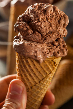 Homemade Dark Chocolate Ice Cream in a Coneの写真素材
