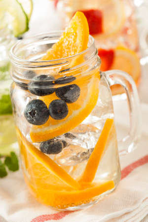 Healthy Spa Water with Fruit on a Backgroundの写真素材