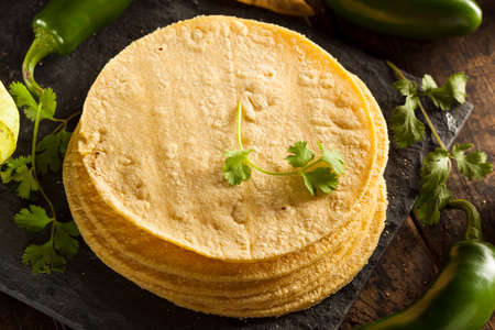 Stack of Homemade Corn Tortillas on a Backgroundの写真素材