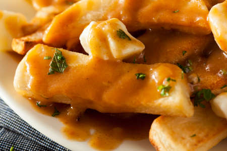 Unhealthy Delicious Poutine with French Fries and Gravyの写真素材