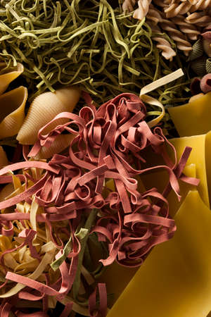 Assorted Homemade Dry Italian Pasta on a Backgroundの写真素材