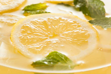Homemade Refreshing Yellow Lemonade with Ice and Mint