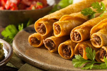 Homemade Mexican Beef Taquitos with Cilantro and Salsaの写真素材