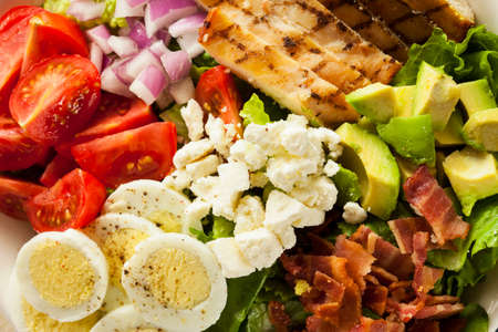 Healthy Hearty Cobb Salad with Chicken Bacon Tomato Onions and Eggsの写真素材