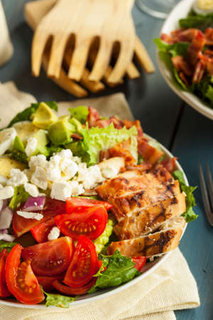 Healthy Hearty Cobb Salad with Chicken Bacon Tomato Onions and Eggsの写真素材