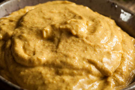 Homemade Spicy Mustard Sauce on a Backgroundの写真素材