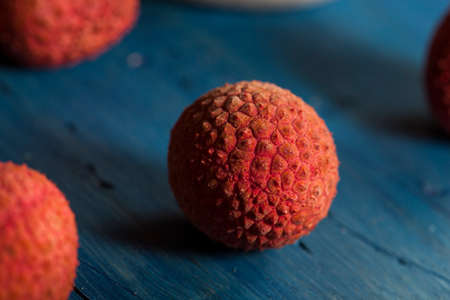 Healthy Organic Red Lychee on a Backgroundの写真素材