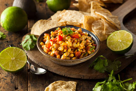 Homemade Spicy Corn Salsa with Tortilla Chipsの写真素材