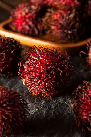 Fresh Organic Tropical Rambutan on a Backgroundの写真素材