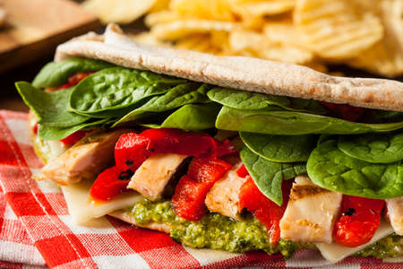 Healthy Grilled Chicken Pesto Flatbread Sandwich with Peppers and Spinachの写真素材