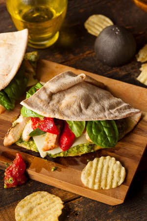 Healthy Grilled Chicken Pesto Flatbread Sandwich with Peppers and Spinachの写真素材